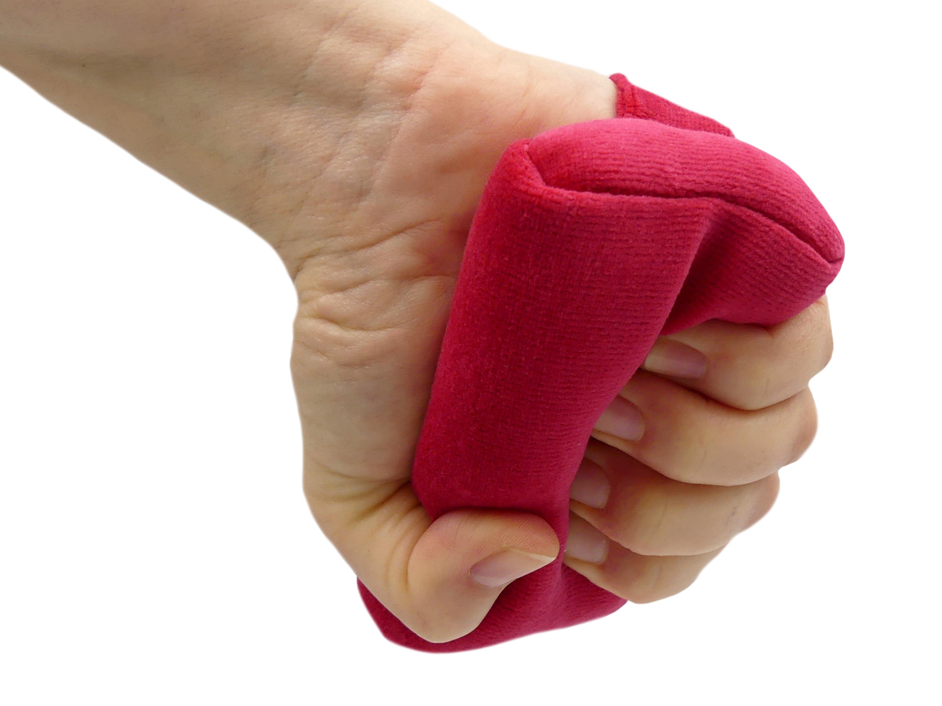 M113 low profile hand grip held in a partly closed hand